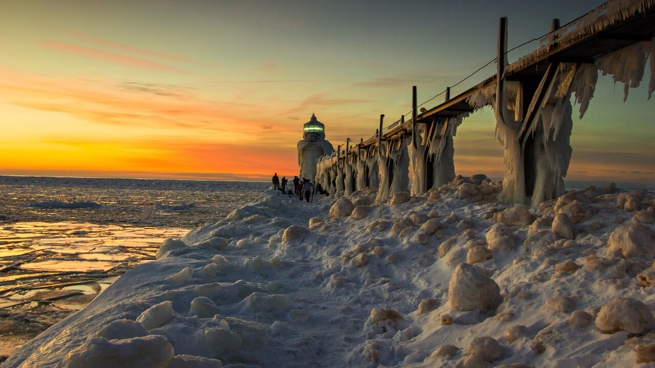 Ice-covered lighthouse at dusk