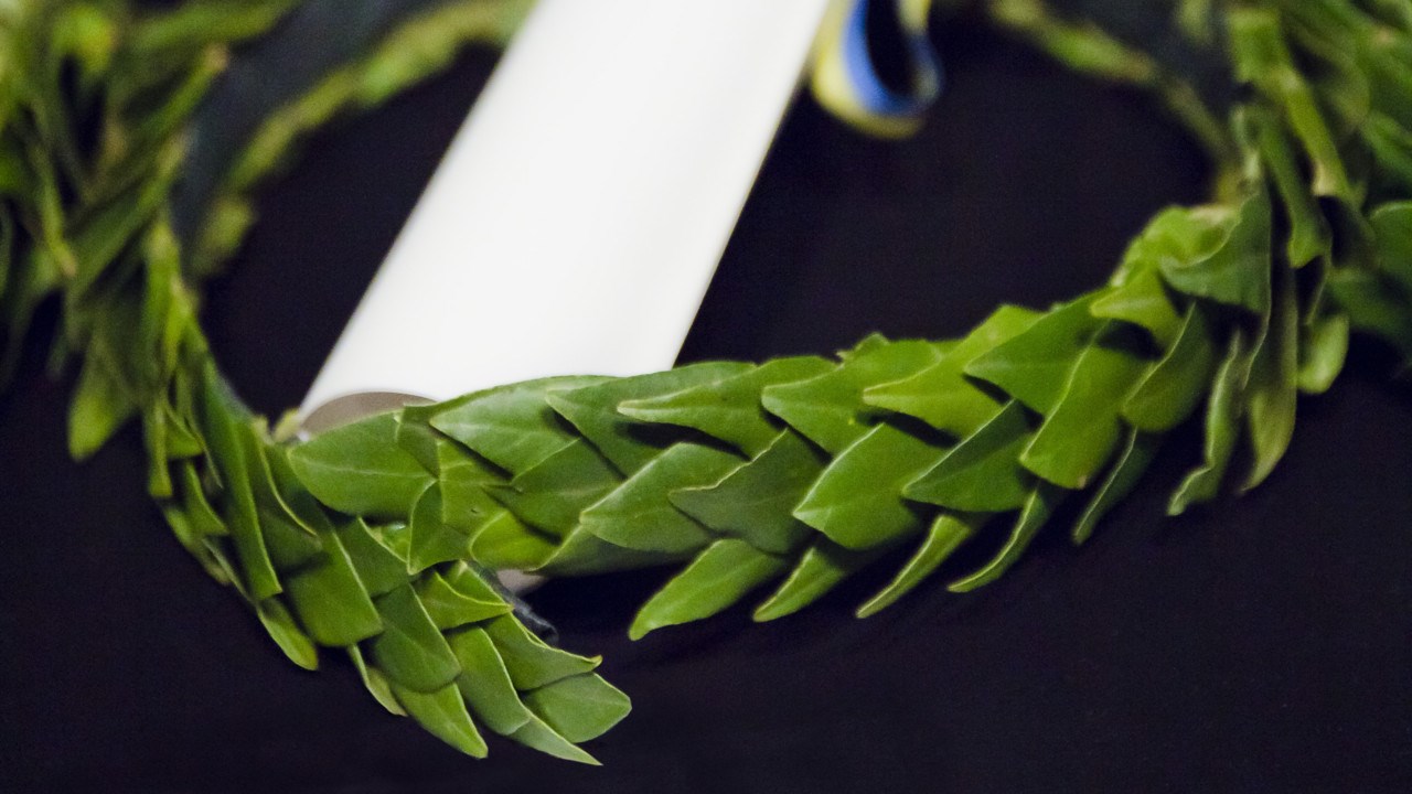 Photo of a laurel wreath and a diploma
