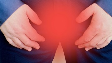 En mans skrev med röd markering. För att illustrera prostatacancer.