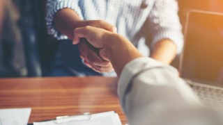 Business People Handshake Greeting Deal at work.