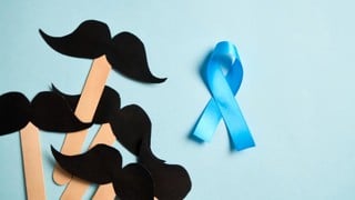 Mustaches on blue background. Prostate cancer awareness month and men health