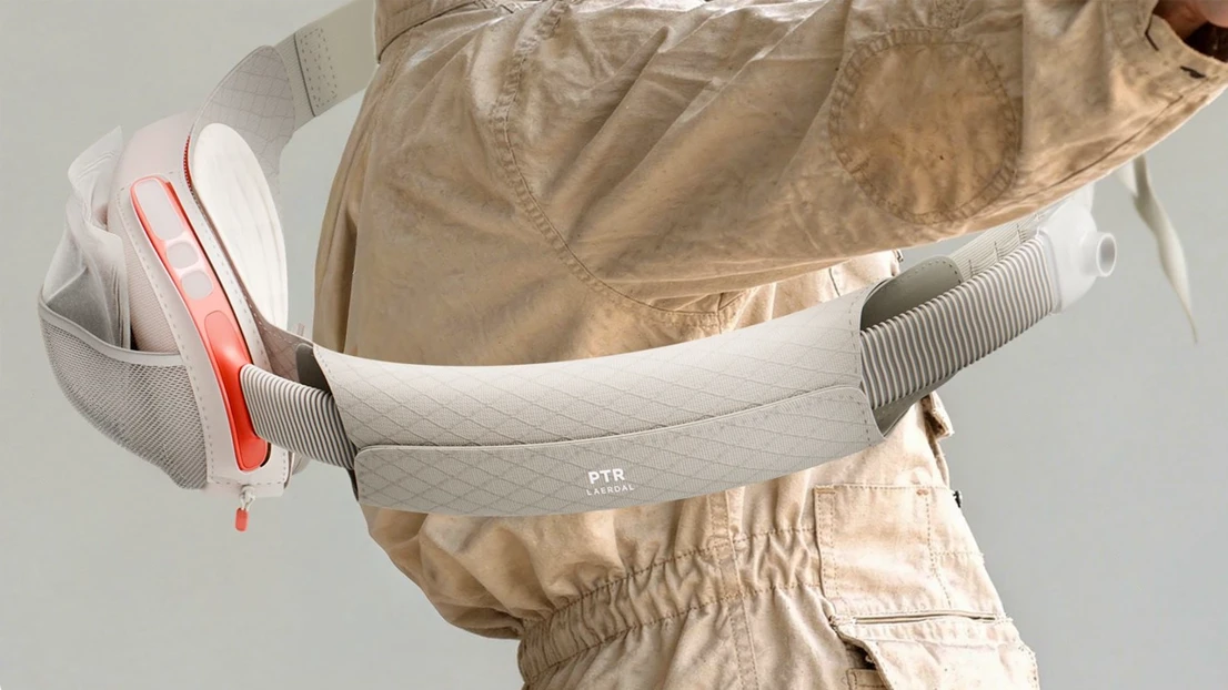A man wearing a protective suit holding a wii controller.