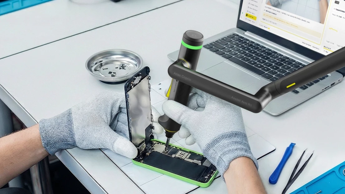 A person working on a cell phone repair project.