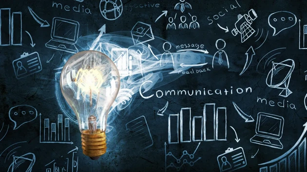 A lightbulb in front of a clutter of ideas. 