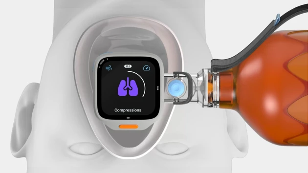 A close up of a device connected to a bottle.