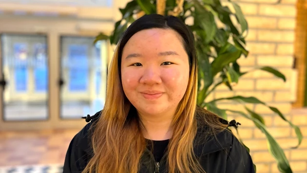 A female student inside one of the buildings on Campus Umeå.