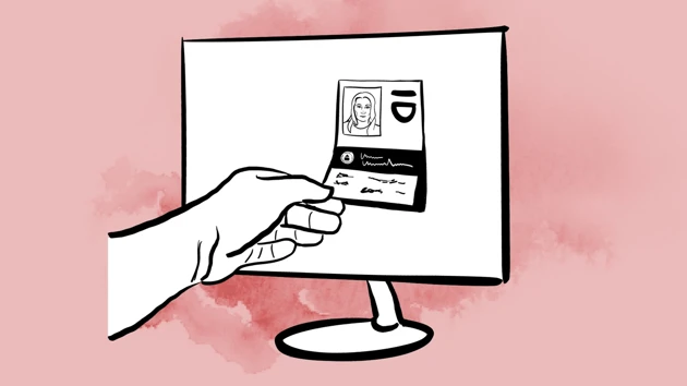 A hand is picking out an ID card from a computer screen.