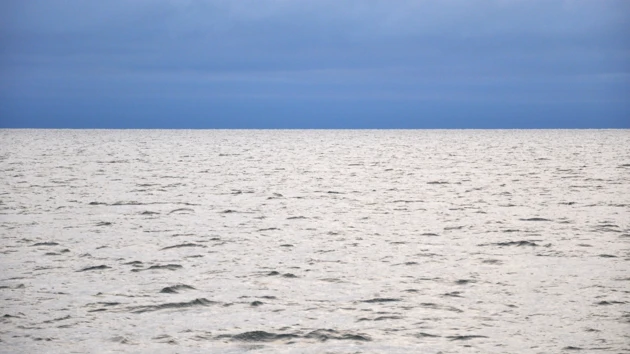 Grey sea and blue sky