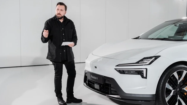 Photo of Juan Pablo Bernal standing in front of a white car