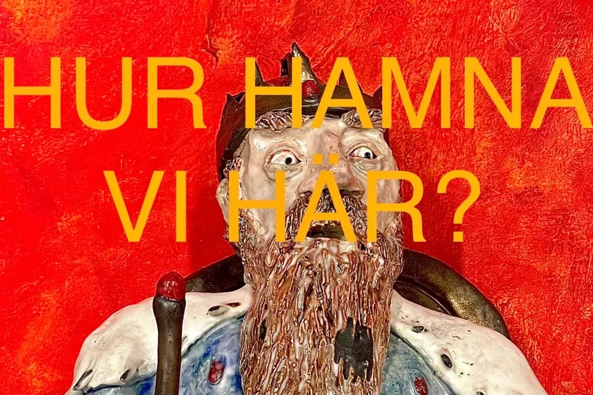 Skäggig man mot röd bakgrund