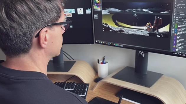Photo of Englander during his 3D animation design process sitting in front of the computer