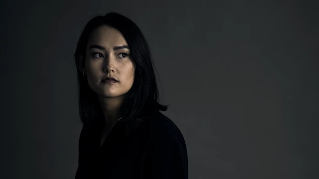 Portrait photo of Kim Onchoi Stenmark against a dark background