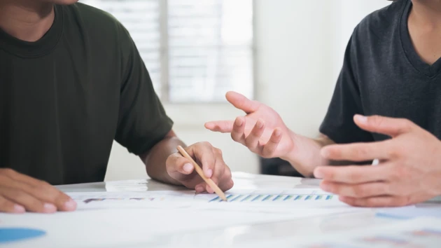 Two persons working together