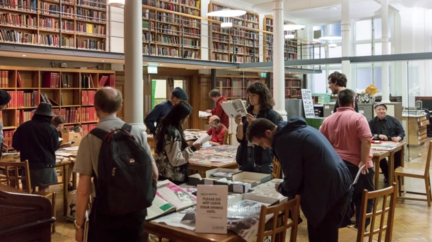 Within the frame of its Special Collections and Archives, the Bishopsgate Institute hosts workshops focusing on different topics in which participants are allowed to explore the collections and arrange material in ways that enable their own sense-making and interpretation of the topic. The photo shows the Art Night Zine Making Workshop at Bishopsgate Institute’s Special Collections and Archives. Photo: Dan Weill.