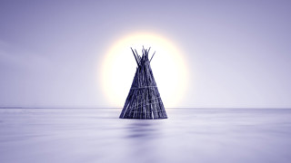 Symbolisk bild av ett knippe med stöttepinnar till en traditionell tältboning
